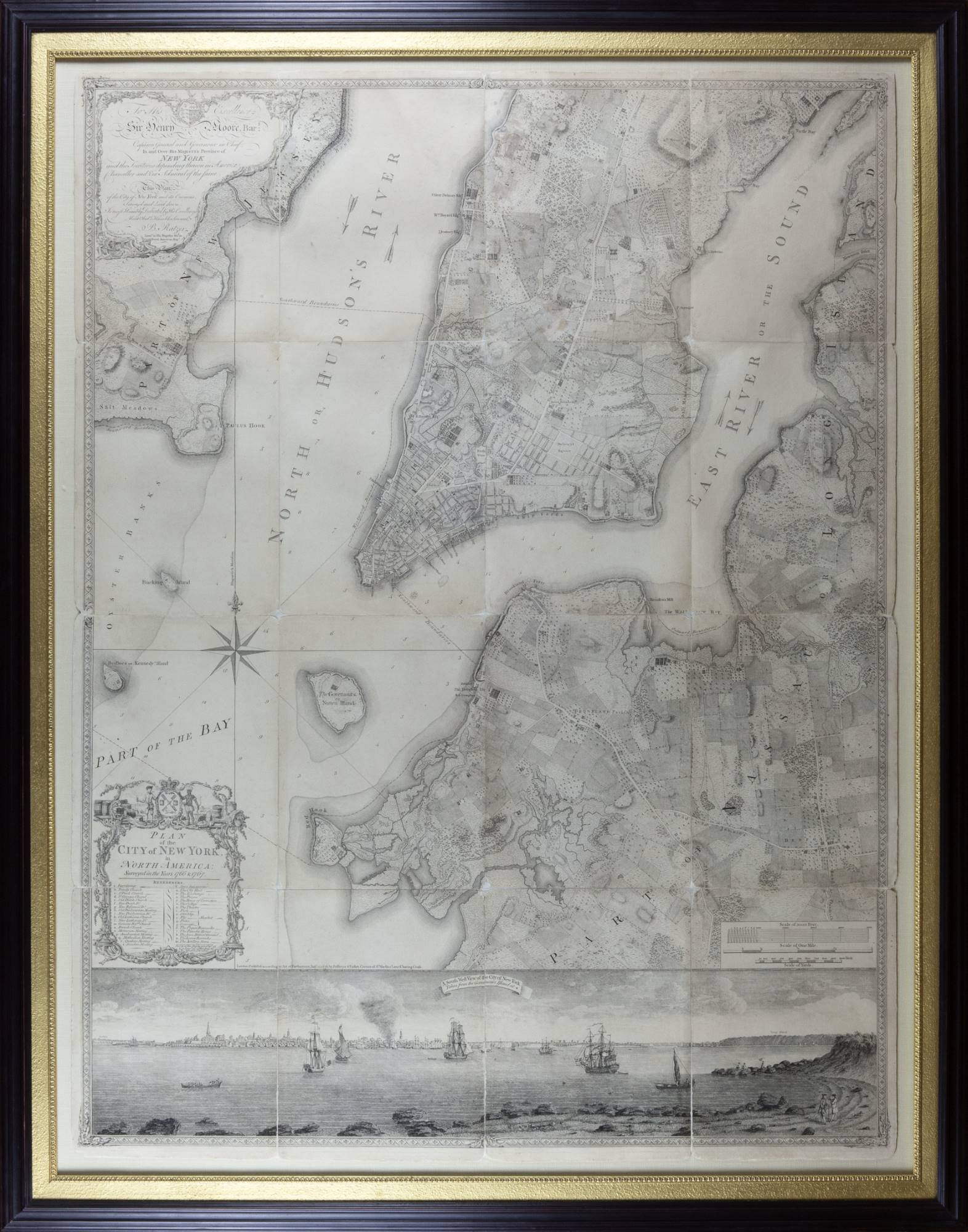 Bernard Ratzer's 1776 engraved map of New York City in a gold and black frame.